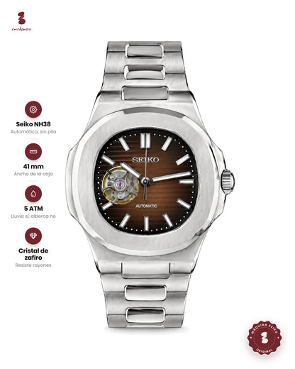Reloj de acero con carátula café y una ventanita que deja ver la máquina